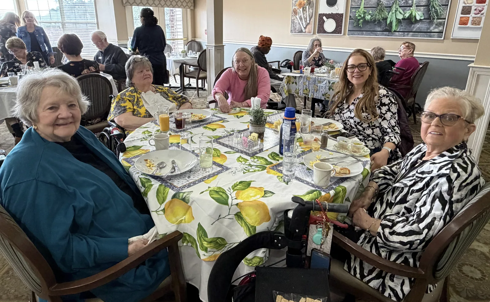 Residents and family at Sunday brunch in the dining room at Comfort Cove Senior Living in West Bloomfield, MI