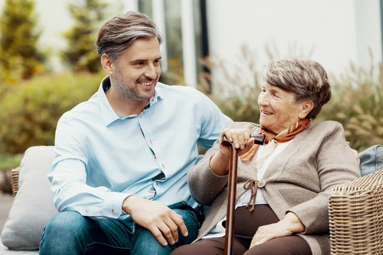 Gilbert with his mother, a resident at Comfort Cove Senior Living in West Bloomfield, MI